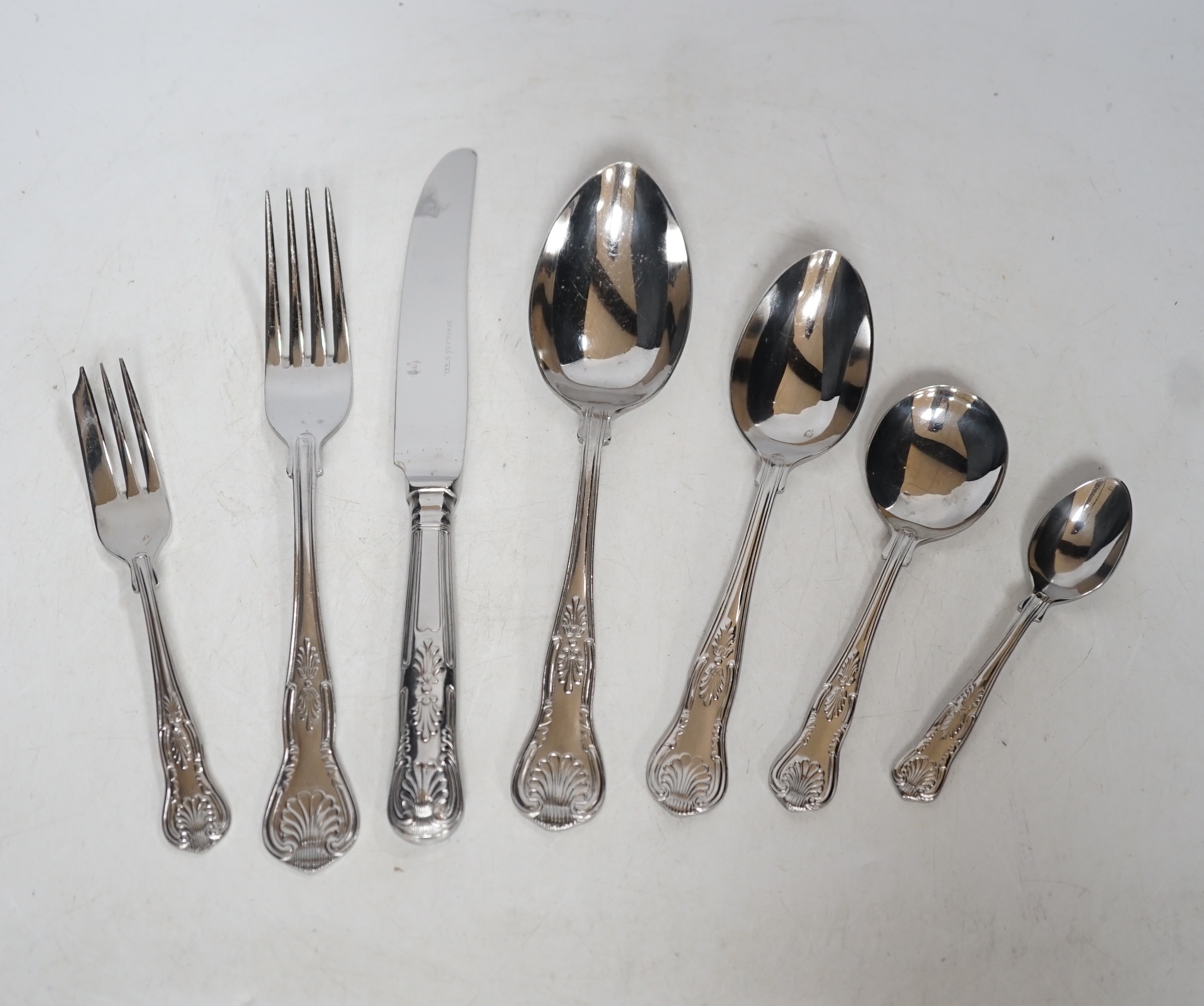A canteen of plated cutlery with tooled leather top, 77cm wide